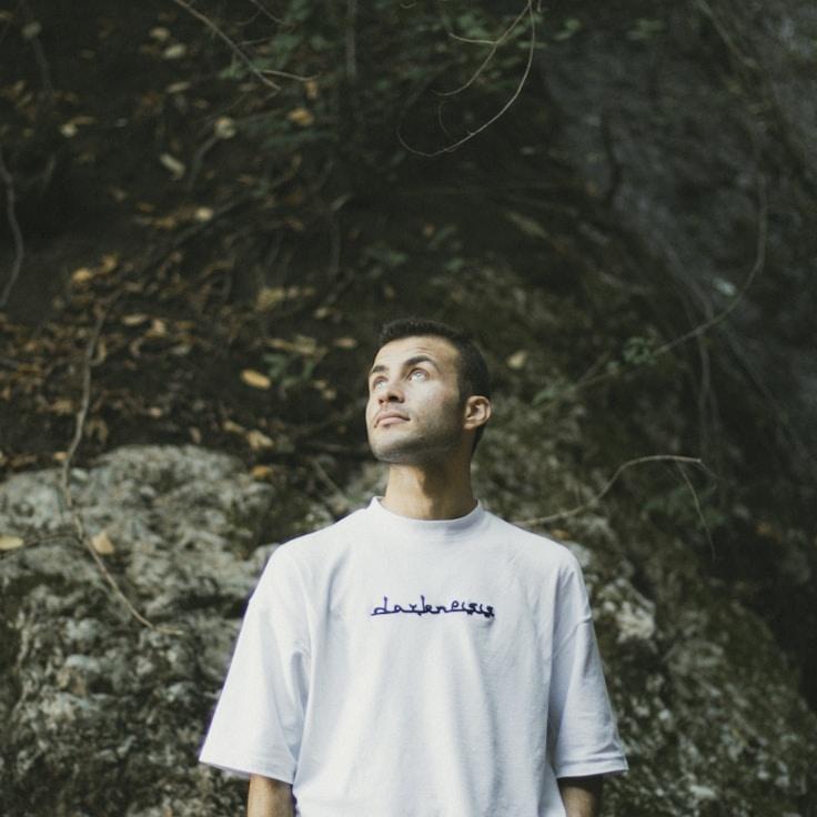 Anya Patel, Lead Design Curator at Brown Paper Anchor, reviewing corporate floral arrangements